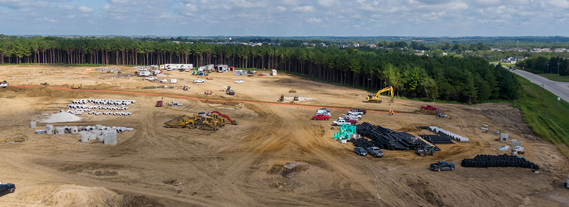 A construction site with trucks and equipment